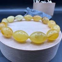 il_fullxfull.7477615797_lech.jpg Milky Yellow Oval Bead Bracelet, Amber-Look Gemstone, 10.3g